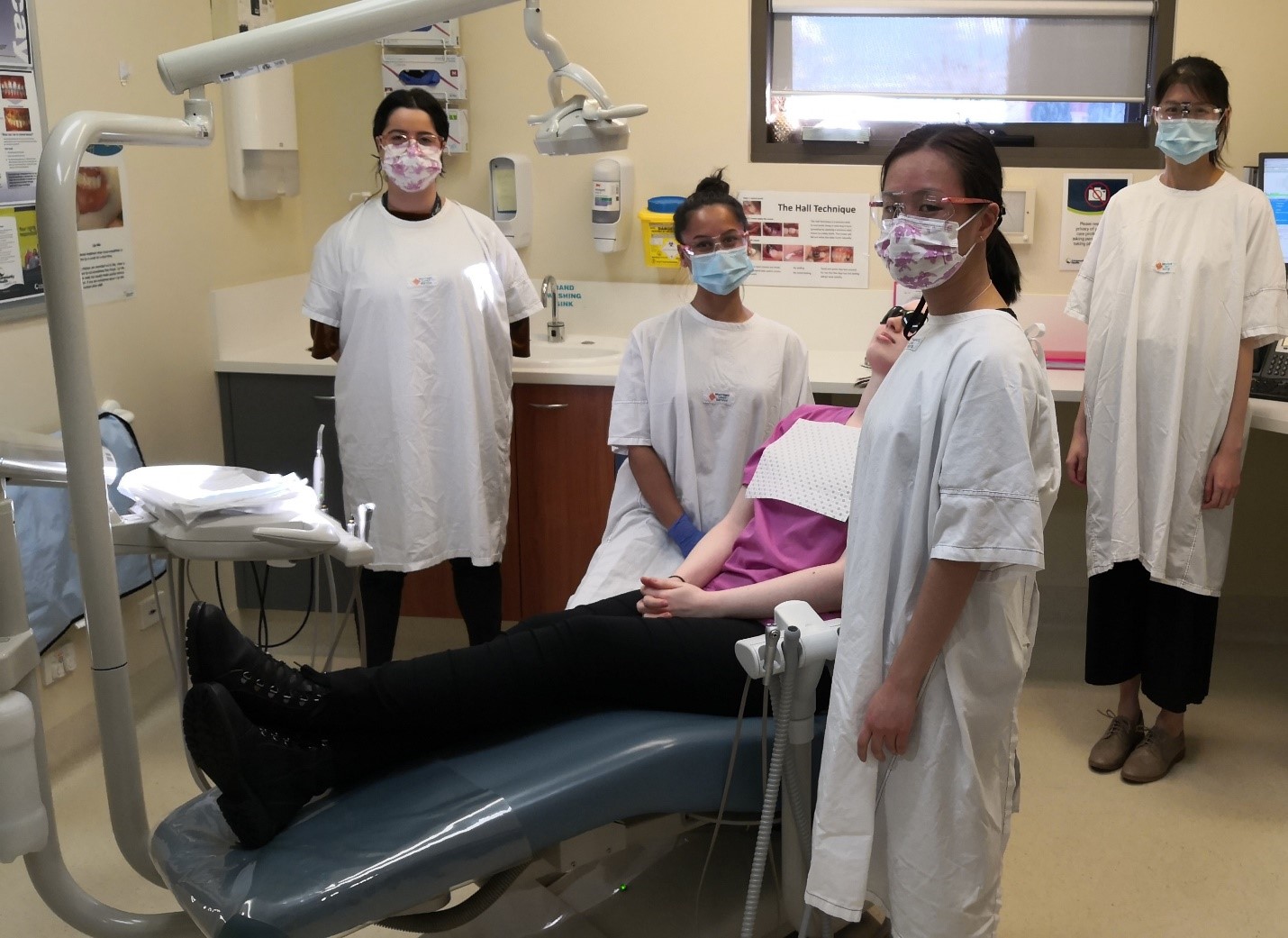 Final year Bachelor of Oral Health students Natasha Prasad, Vanessa Tu and Serlin Ching happy to be providing treatment at the Morwell clinic. Their supervisor, Oral Health Therapist, Nicoletta Psilos (left), was herself a University of Melbourne graduate 5 years ago.