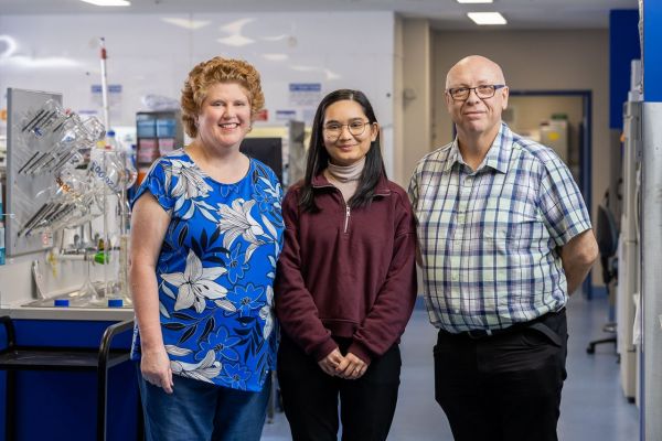 L-R: Associate Professor Catherine Butler stands with her team, Dr Bansari Shah and Dr Giuseppe Ciccotosto, in the laboratory at Melbourne Dental School