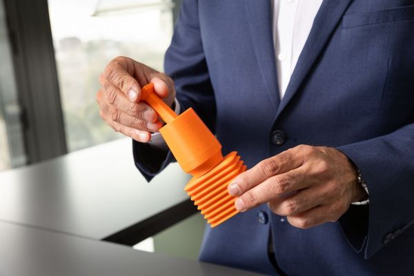 Associate Professor Roy Judge stands with a prototype of the Rectangular Block Implant in a laboratory space in the Aikenhead Centre for Medical Discovery. Credit: Peter Casamento