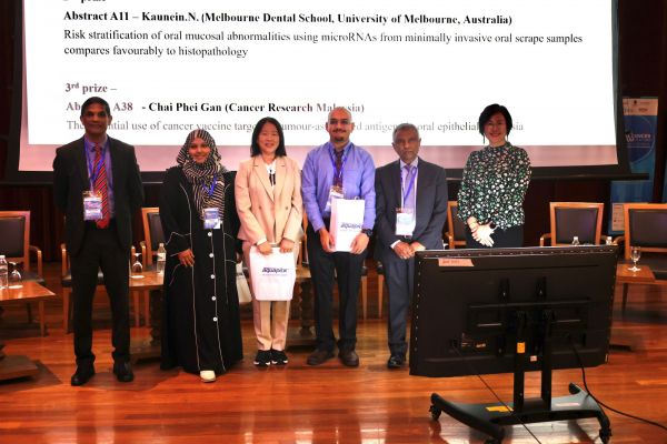 Dr Nadia Kaunein with awardees on stage, second from the left, receiving the award at the Global Oral Cancer Forum, Kuala Lumpur, Malaysia