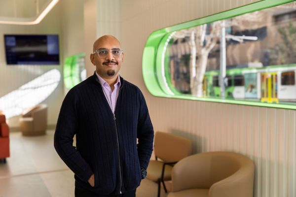 PhD student Dr Rishi Ramani facing the camera at the Royal Dental Hospital Melbourne.