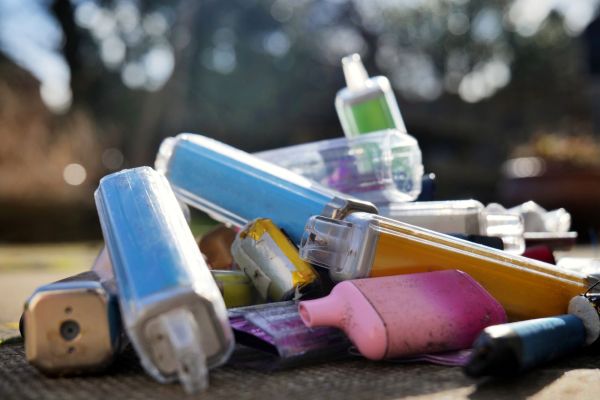 A close-up of discarded and used vapes